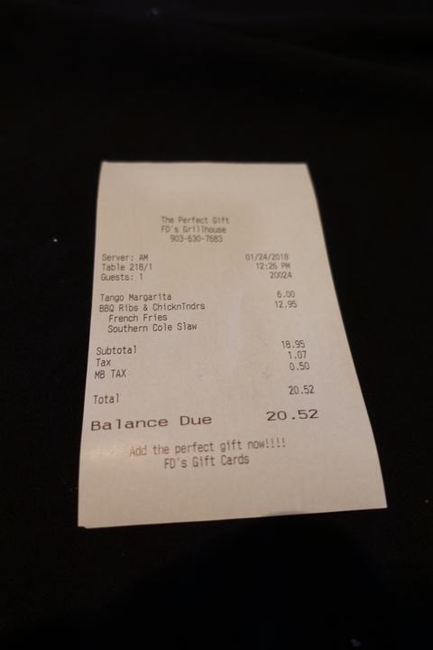 The bill for the ribs and chicken meal plus a margarita from FD's Grillhouse.